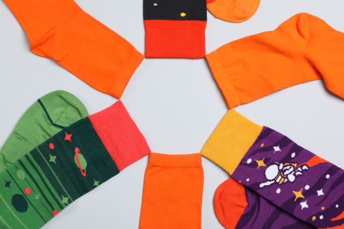 Casual clothes and wearing concept - socks, clothes for foot