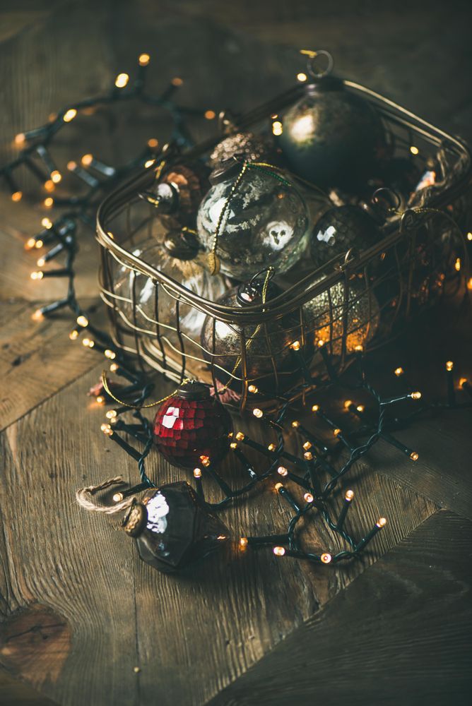 Christmas tree decorations in wire box, with garland, vertical composition