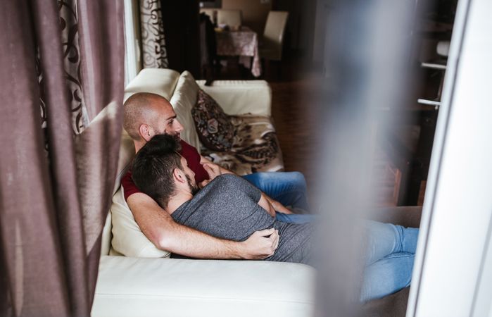 young gay couple at home