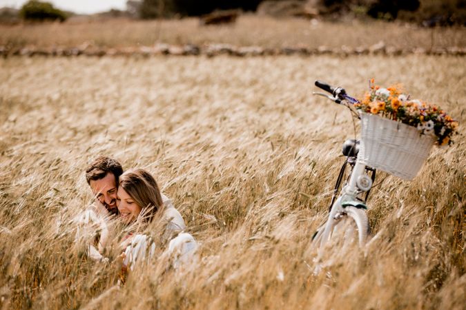 Serene lovers embracing on wheat field