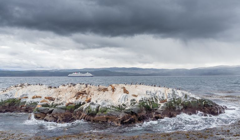 Rough islet in stormy sea