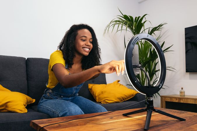 Young woman creates content with phone