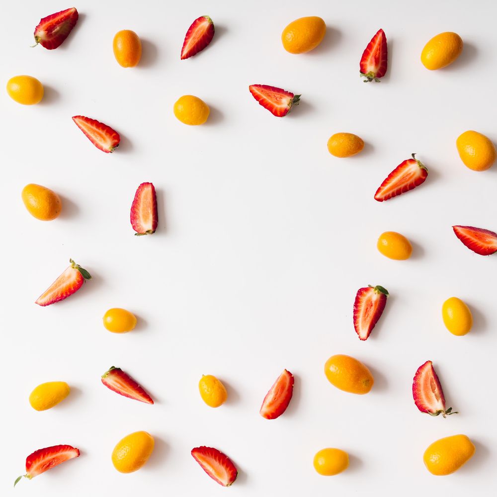 Pattern made of kumquats, strawberries
