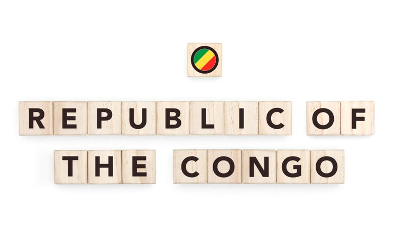 Wooden blocks bearing the name and flag of Republic Of The Congo. Congolese and African Culture, national identity, travel, and geography in a copy space design.