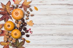 Autumn leaves with fall vegetables with copy space