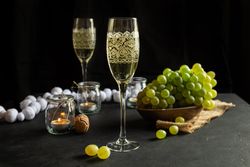 Glasses with wine and grapes