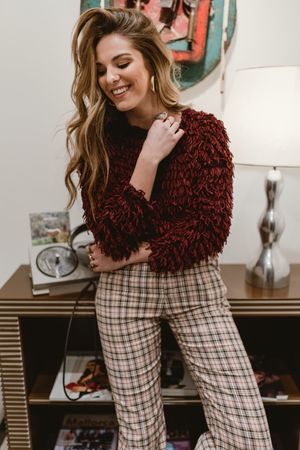 Cheerful woman in stylish room