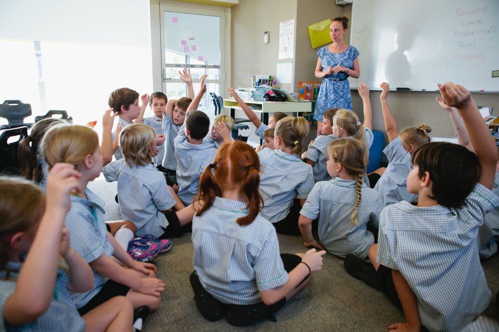 Teacher and young students in classroom