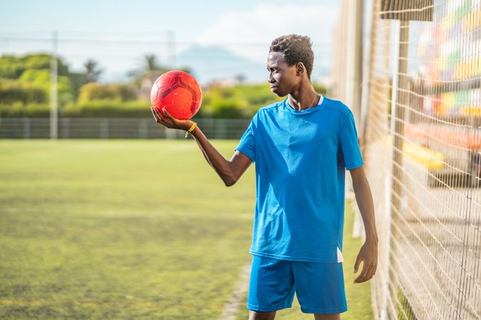 Black teenager on football field