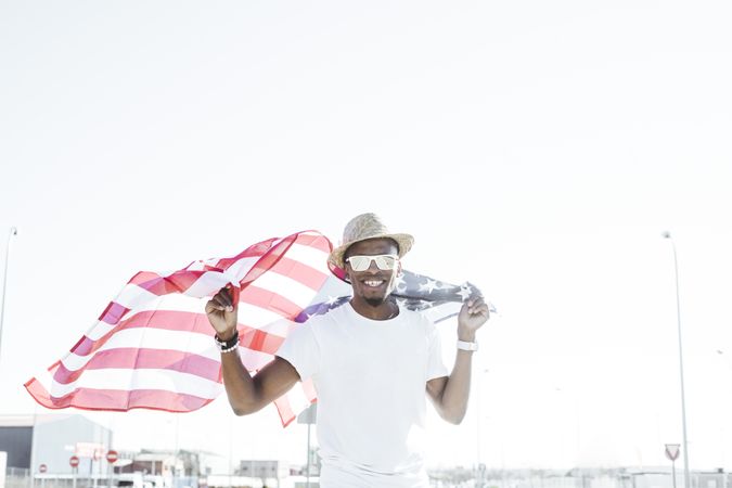 Cheerful black man with American flag