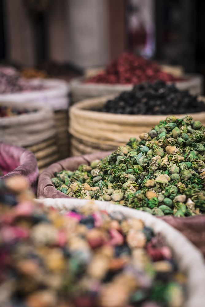 Baskets with dried spices on marketplace