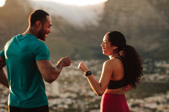 Fitness couple giving fist bump after the workout