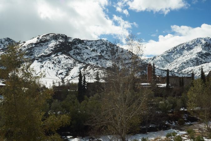 Ancient city between hills in snow and wonderful sky