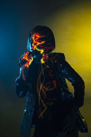 Stylish woman singing on stage