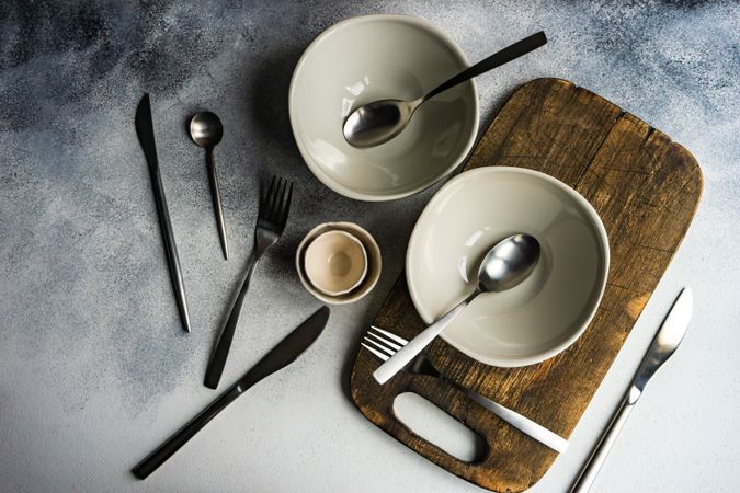 Top view of chic cutlery set on concrete background