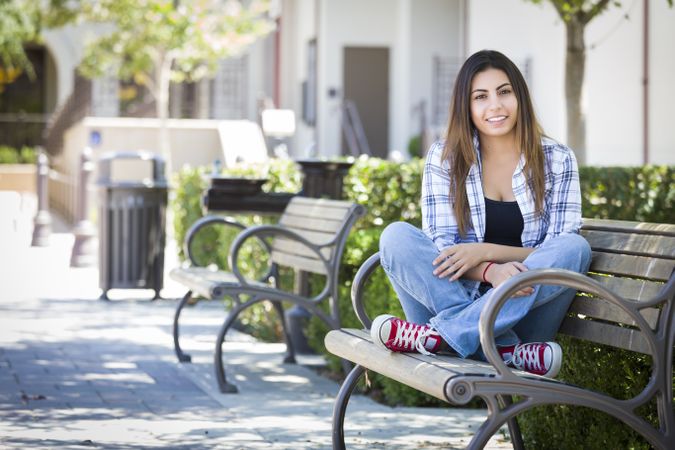 Female Student Portrait on School Campus Bench