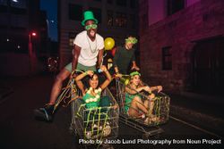 Friends celebrating St.Patrick's day on city street 0V6zQY