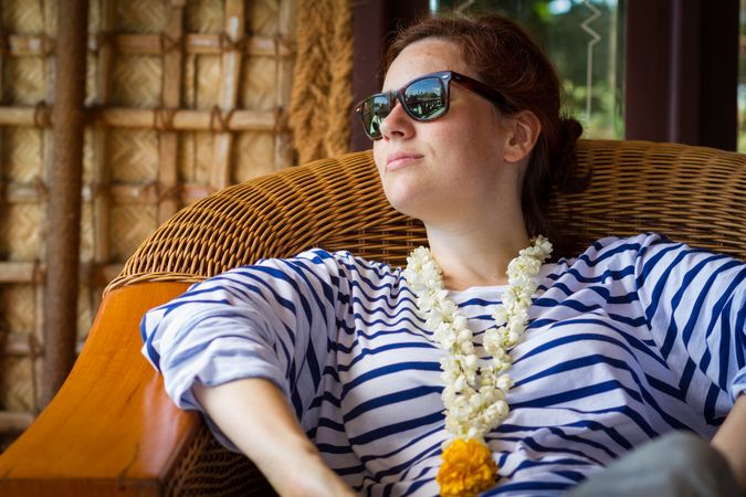 Woman relaxing on terrace near sea