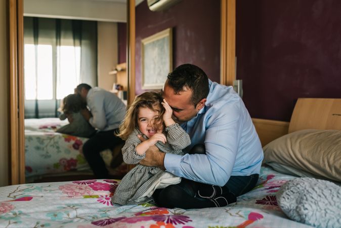 Father playing with daughter