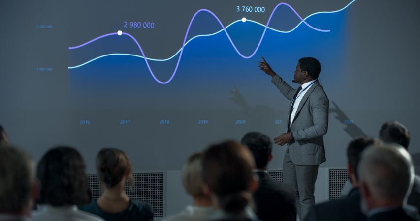 Corporate Event: Black Male Tech CEO Giving Presentation To Colleagues or Investors In Conference Room Of Innovative Startup Office.