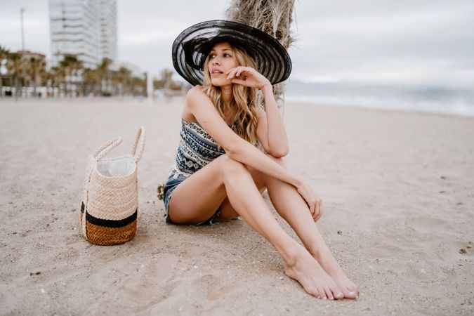 Young female relaxing on beach
