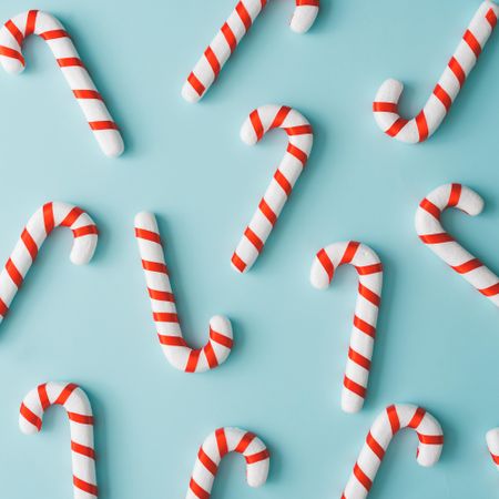 Candy canes on bright blue background