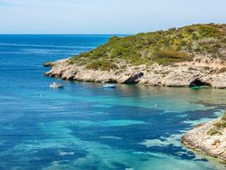 Cala Portinax bay with beautiful azure blue sea water
