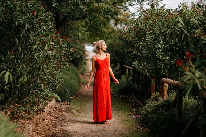 Dreamy young woman in summer garden