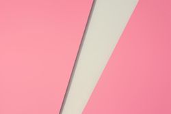 Pink paper with light geometric cut out