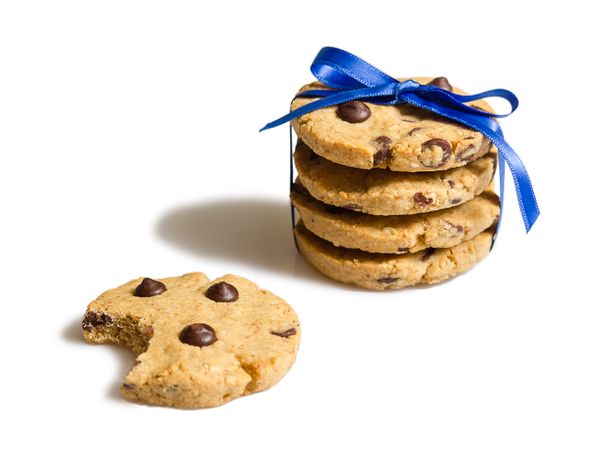 Closeup of chocolate chip cookies pile isolated on plain backgro