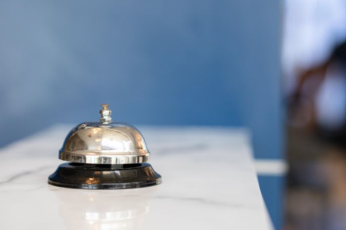 “Ring for Service” bell on marble counter