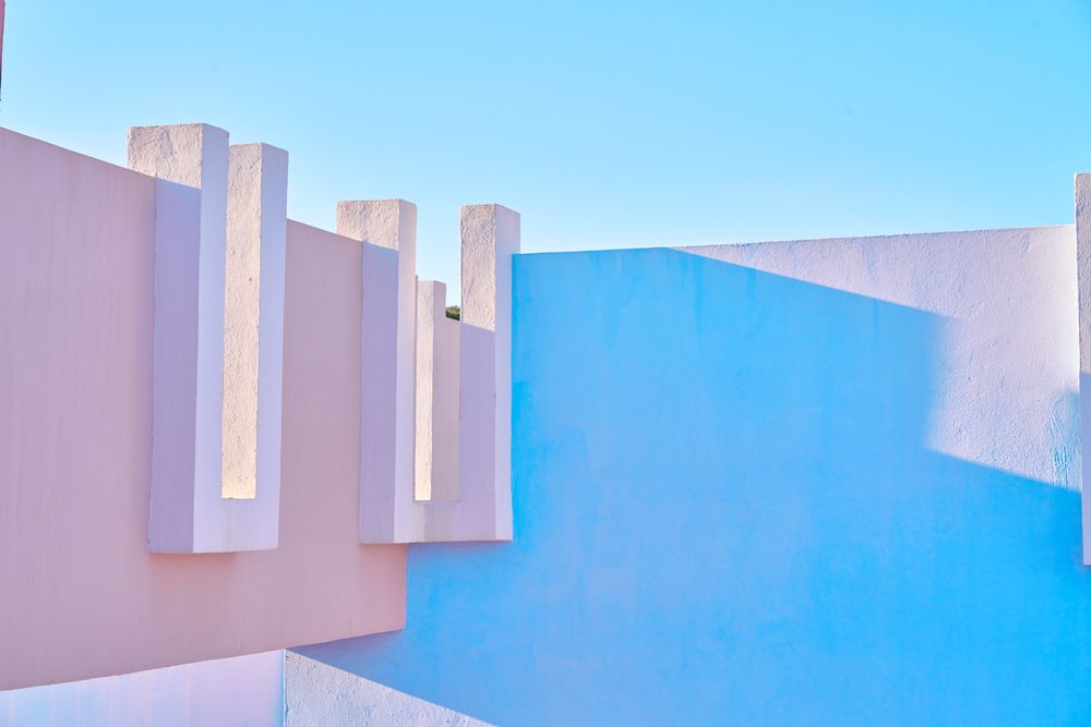 blue and pink wall construction against blue sea