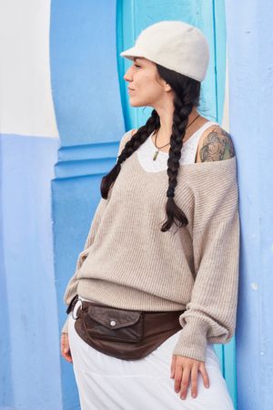 Smiling woman posing near vintage door