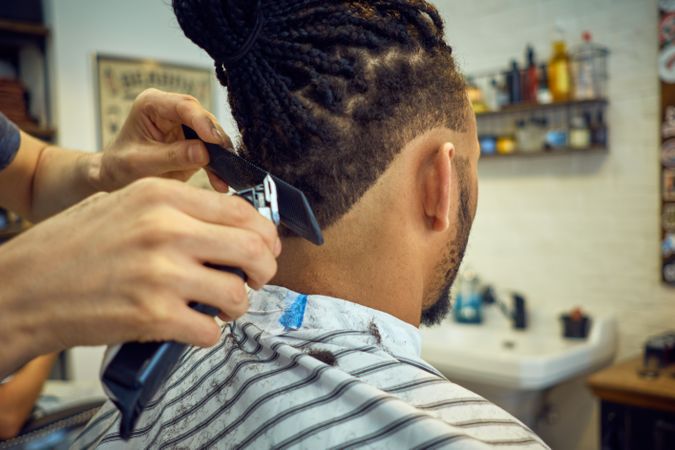 Anonymous hairstylist doing a haircut