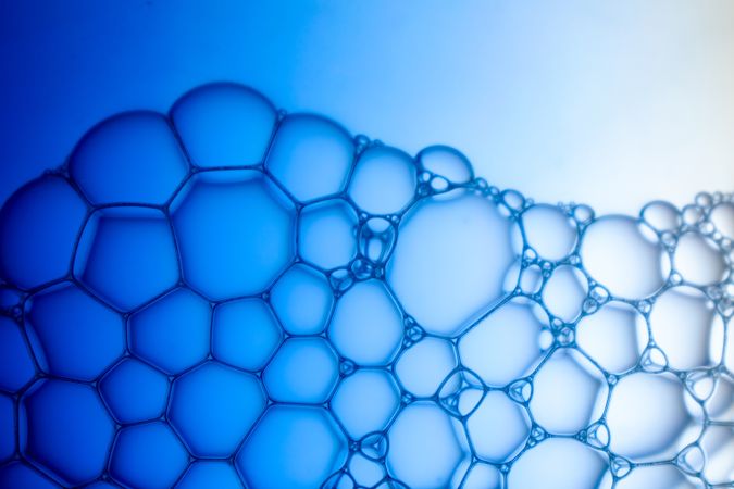 Abstract background bio technology, macro photography foam and water with gradient background. Molecule multicolor backgorund