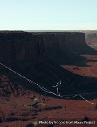 Person tightrope walking in Grand Canyon 0KQqY4