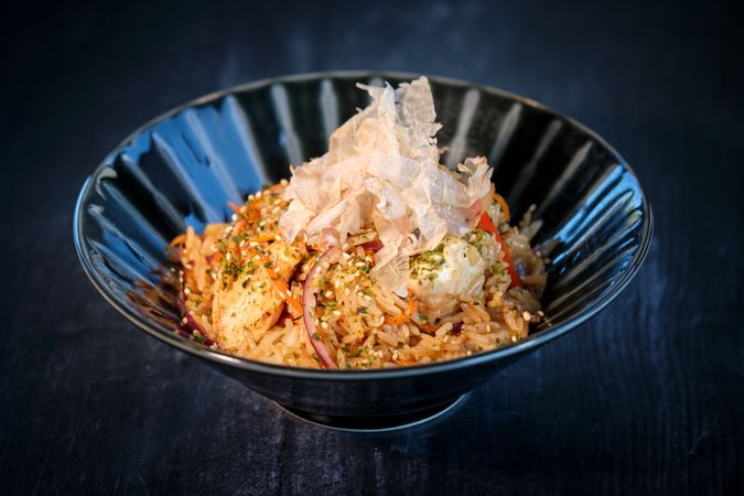 Delicious dish of rice in bowl served on table