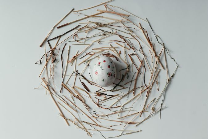Floral patterned Easter egg in deconstructed, twig nest