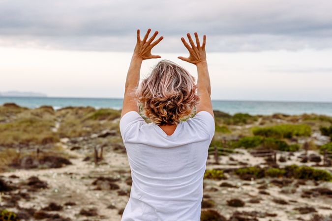 Adult woman practicing martial arts in nature