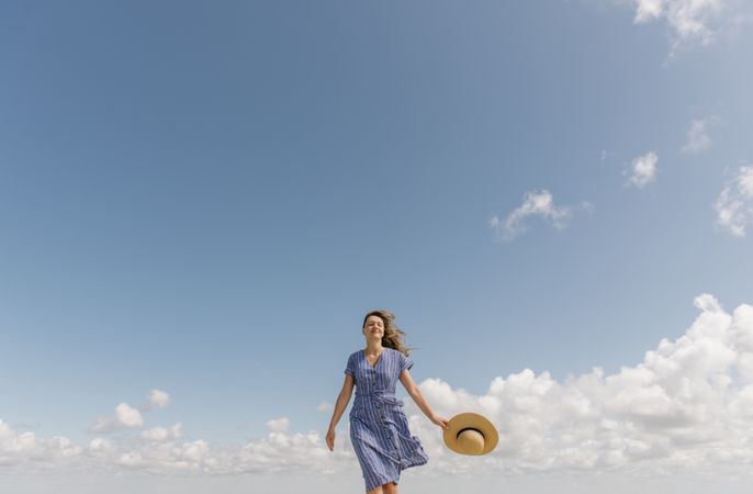 Happy young woman enjoying breeze