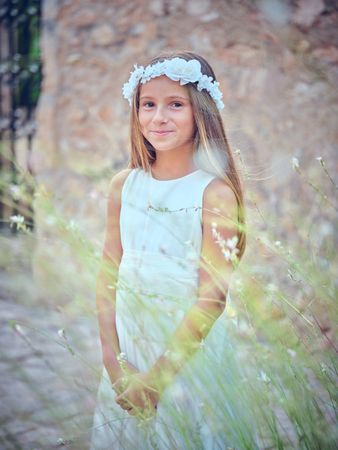 Charming girl in flower wreath