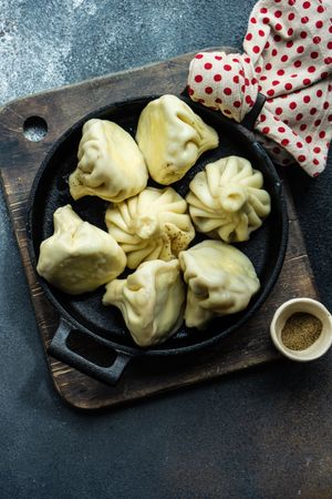 Top view of iron cast pan of traditional Georgian khinkali dumplings