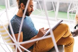 Man writing in a notepad