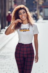 Smiling Arab woman with curly hair walking down sunny street