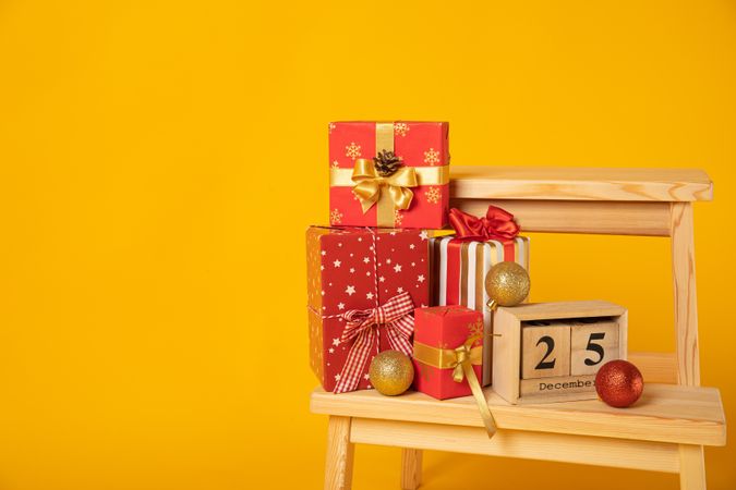 Concept of Merry Christmas, Christmas accessories on yellow background, space for text