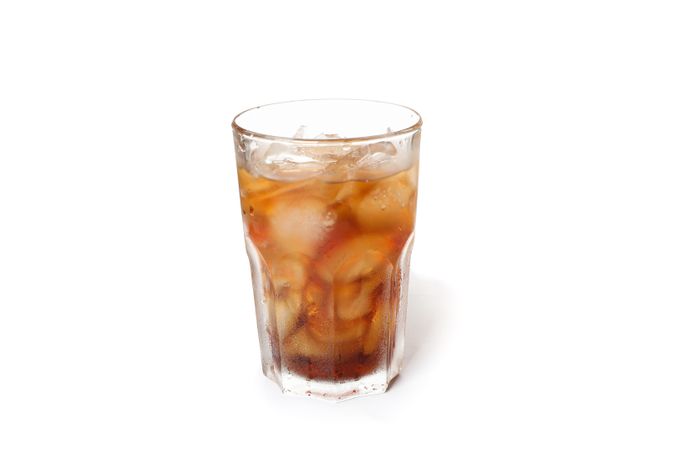 Glass of cold cola isolated on blank background