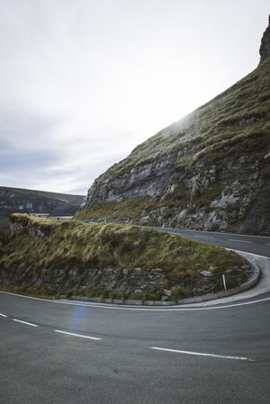 Road leaning between mountains