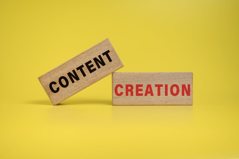 content creation words on wooden blocks on yellow background
