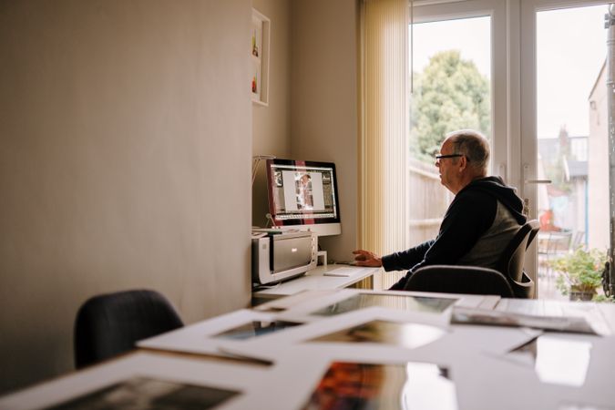 Older man working in his home office