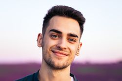 Portrait of a young man in the countryside